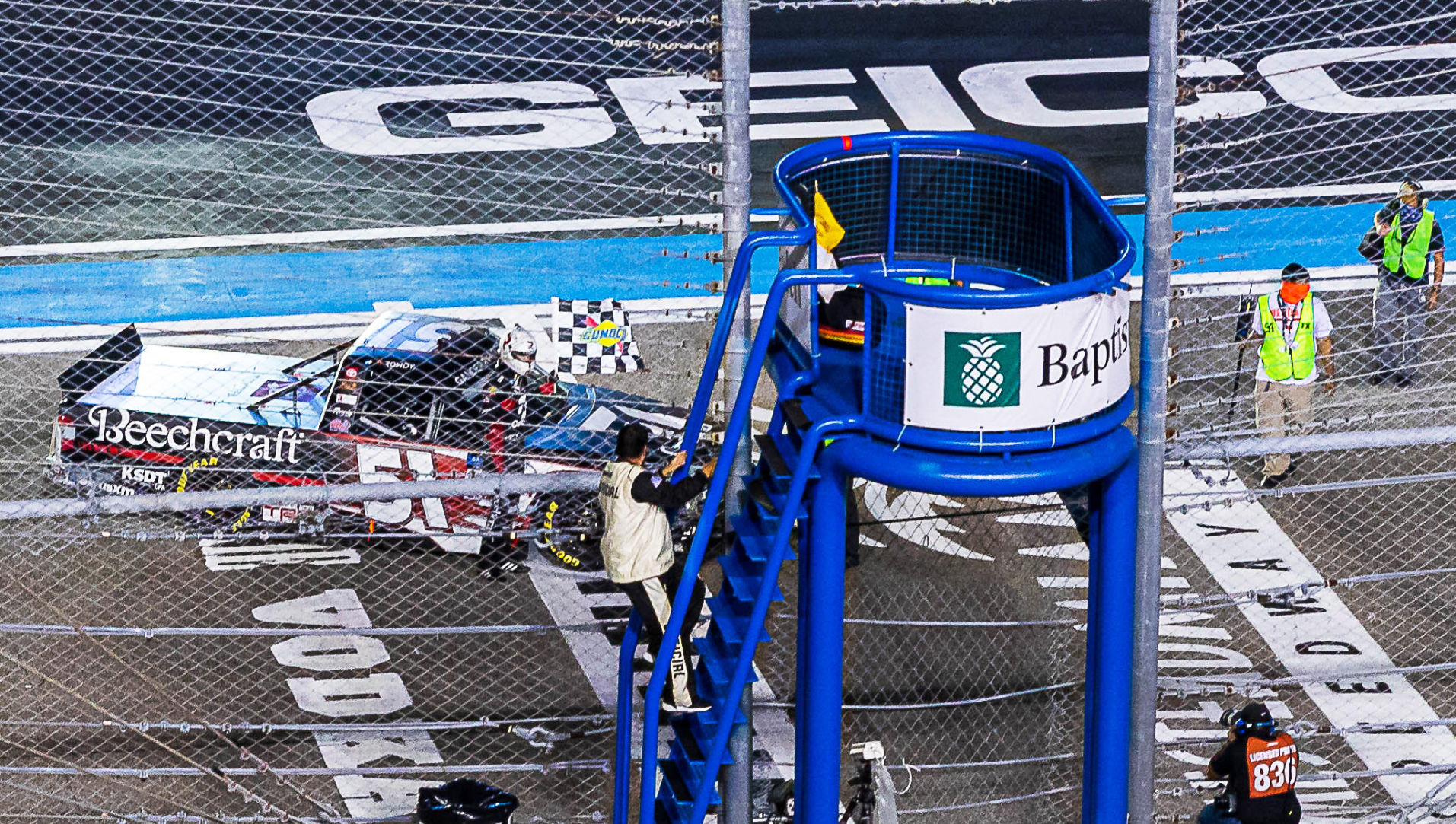 Kyle Busch takes the checkered flage on Saturday at Homestead.